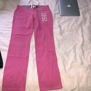 Pink sweatpants, shows curves